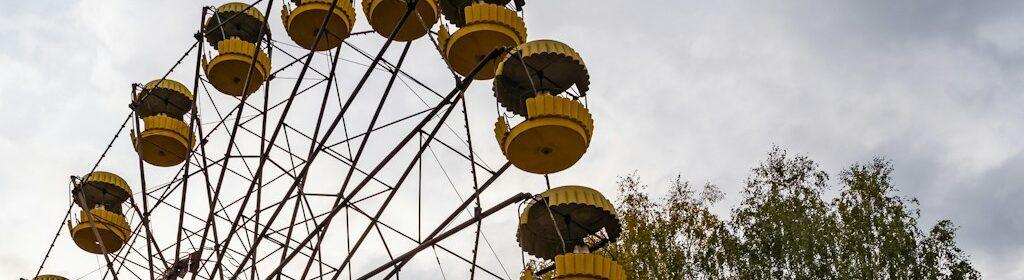 brown and white ferris wheel under blue sky during daytime